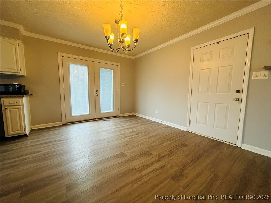 5901 Rehoboth Road Hope Mills, NC 28348 - Photo 19 of 22 a view of empty room with wooden floor and fan