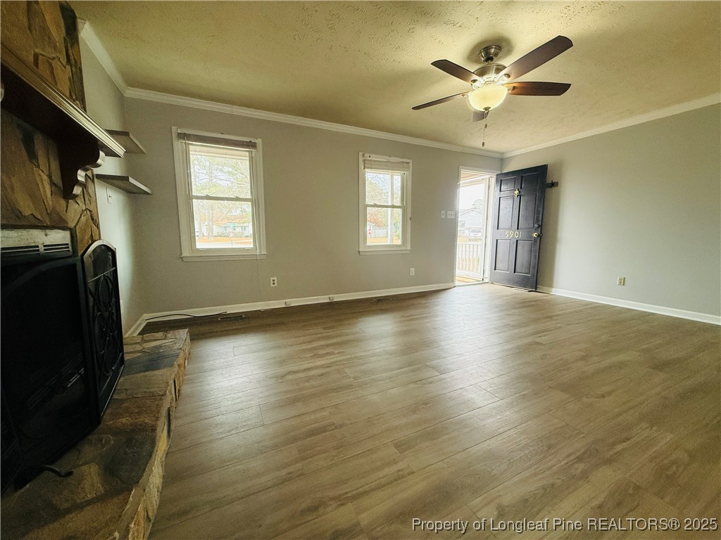 5901 Rehoboth Road Hope Mills, NC 28348 - Photo 4 of 22 a view of an empty room with a window and wooden floor