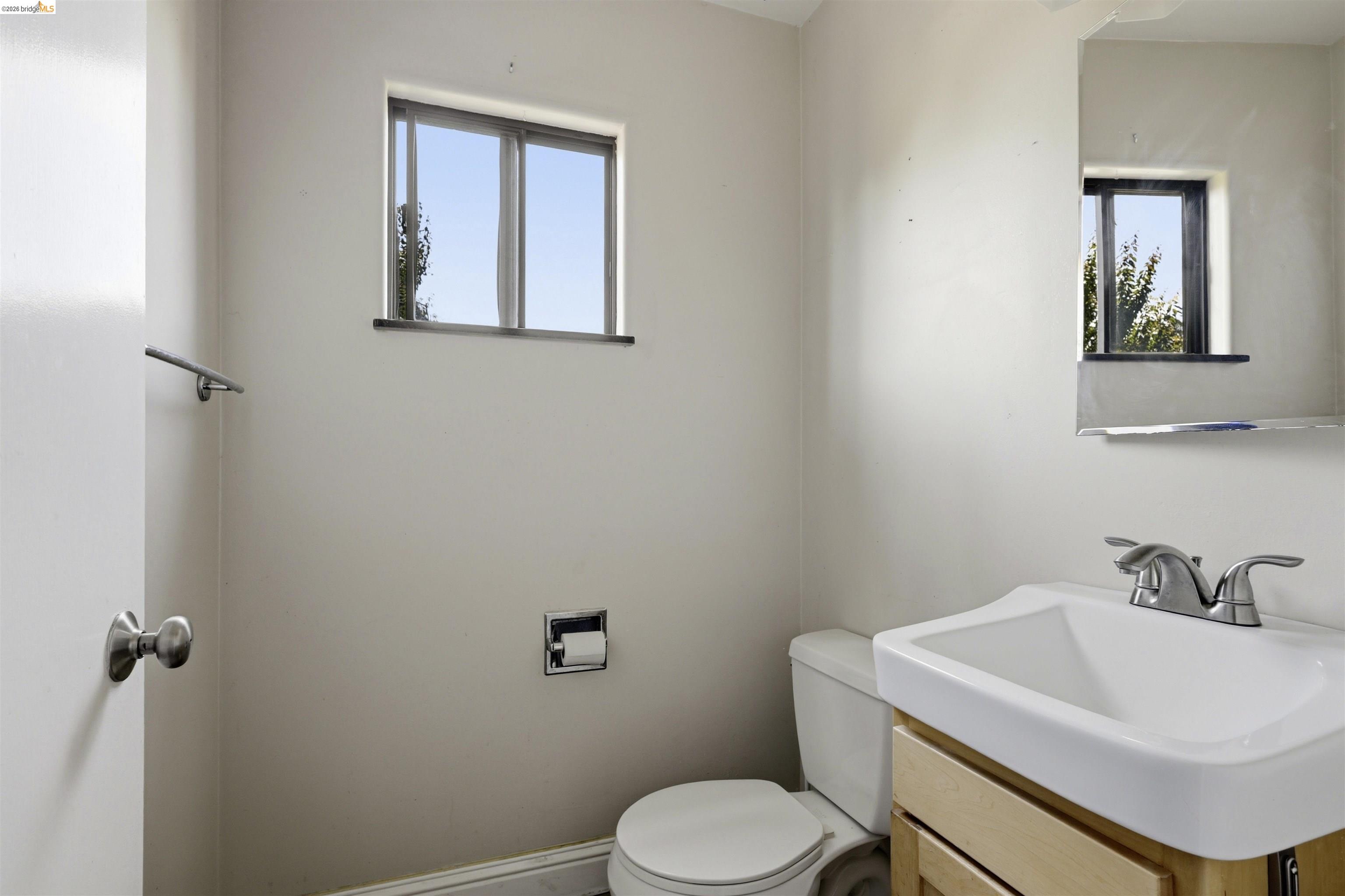 7555 Sunset Way, Unit 6 Aptos, CA 95003 - Photo 21 of 37 Bathroom featuring a single-pane window, vanity with a rectangular basin sink, and chrome fixtures