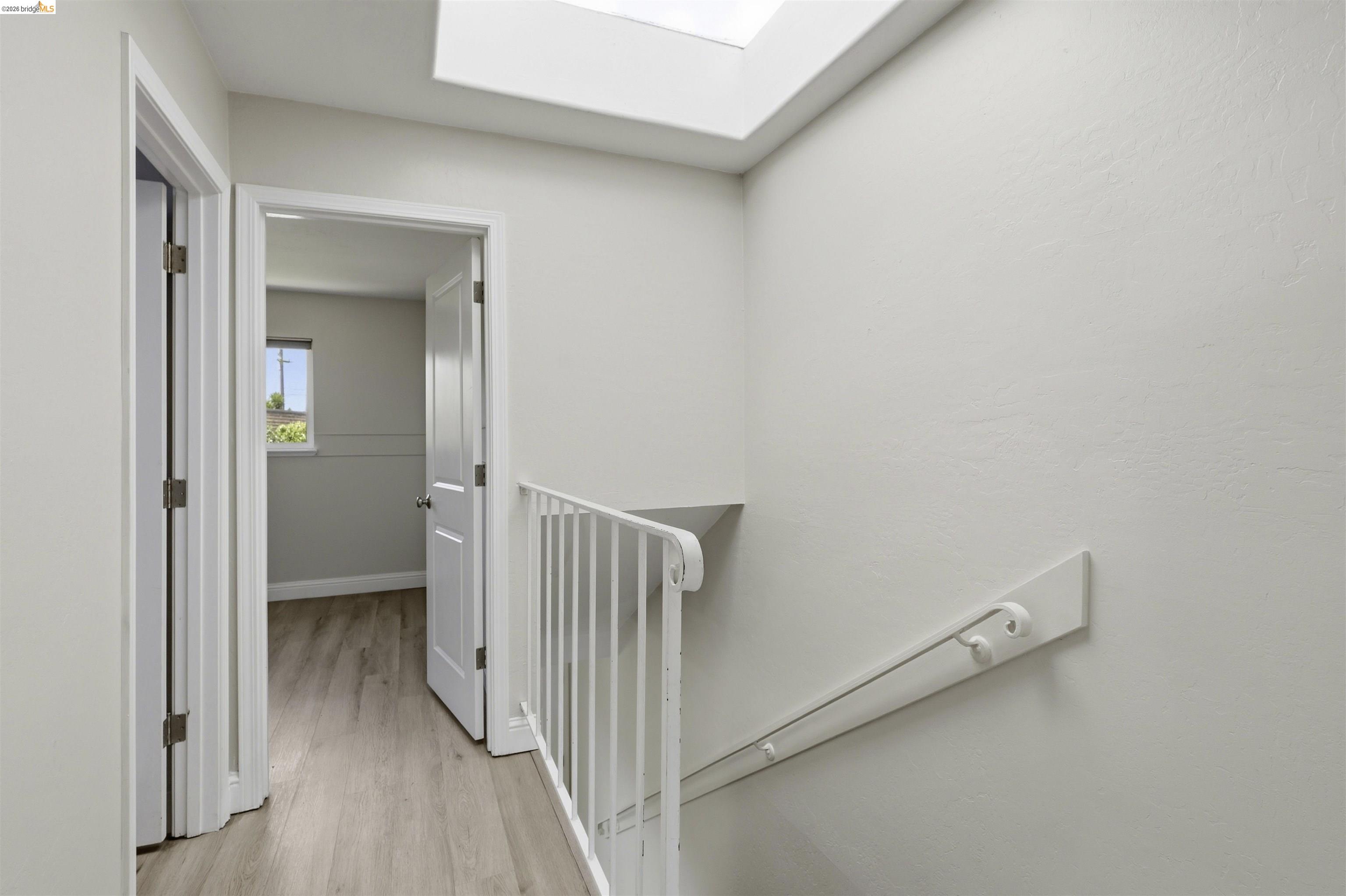 7555 Sunset Way, Unit 6 Aptos, CA 95003 - Photo 24 of 37 Hallway with wood-finish flooring and a skylight