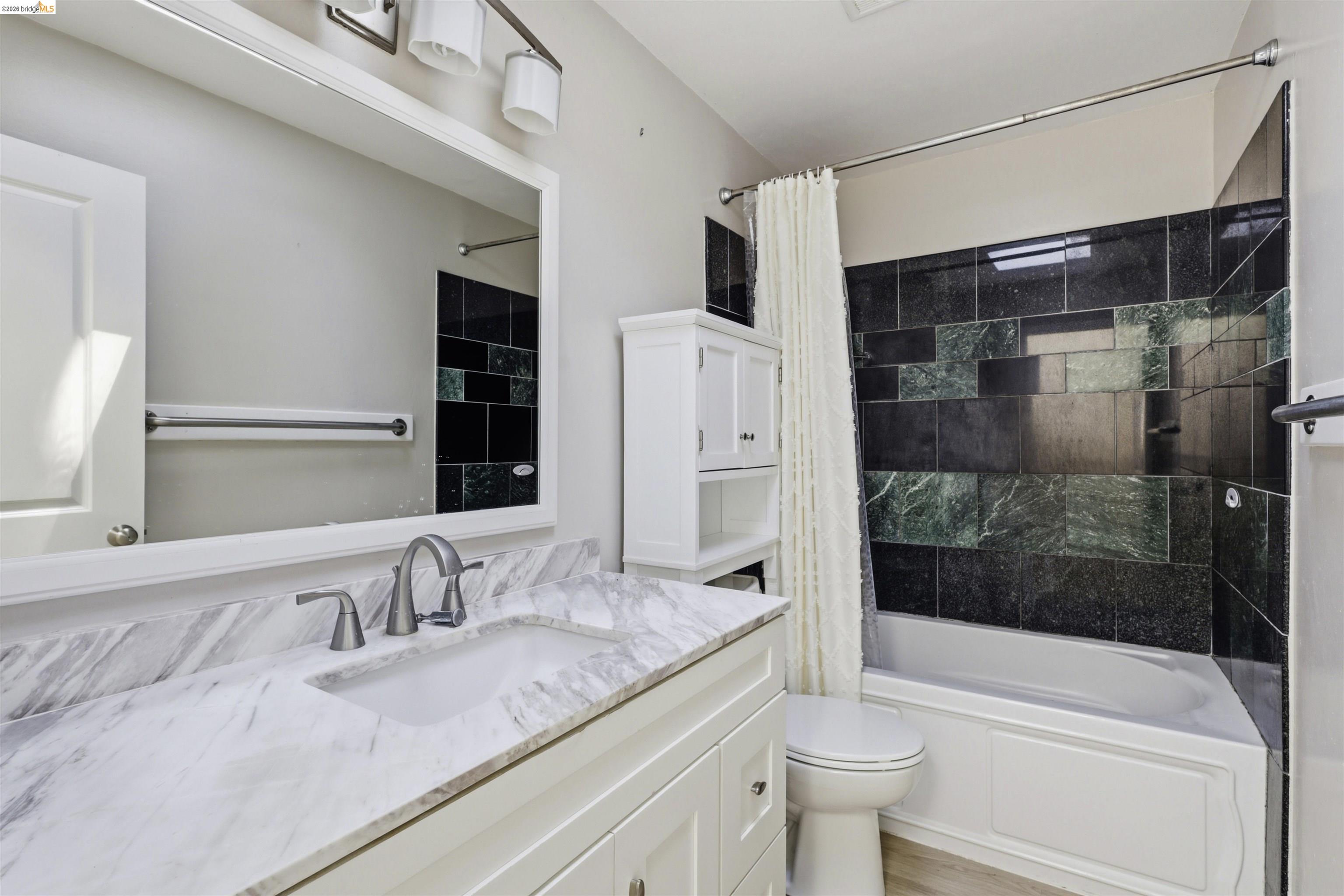 7555 Sunset Way, Unit 6 Aptos, CA 95003 - Photo 31 of 37 Bathroom vanity with a rectangular undermount sink, a gray veined countertop, and a brushed nickel widespread faucet