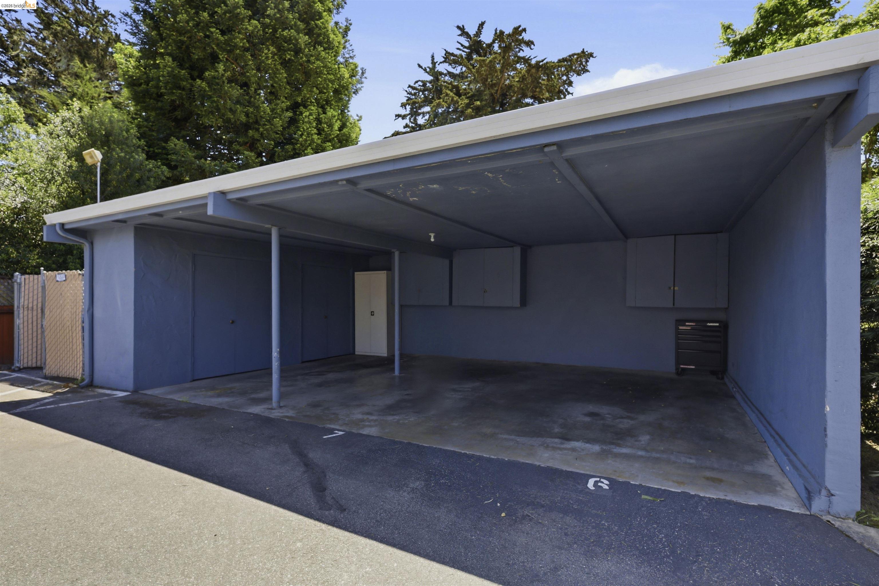 7555 Sunset Way, Unit 6 Aptos, CA 95003 - Photo 36 of 37 Covered parking structure with concrete flooring and a flat roofline