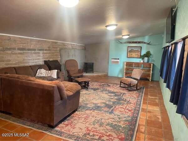 1094 North Pomerene Road Benson, AZ 85602 - Photo 5 of 48 a bedroom with bed and a couch