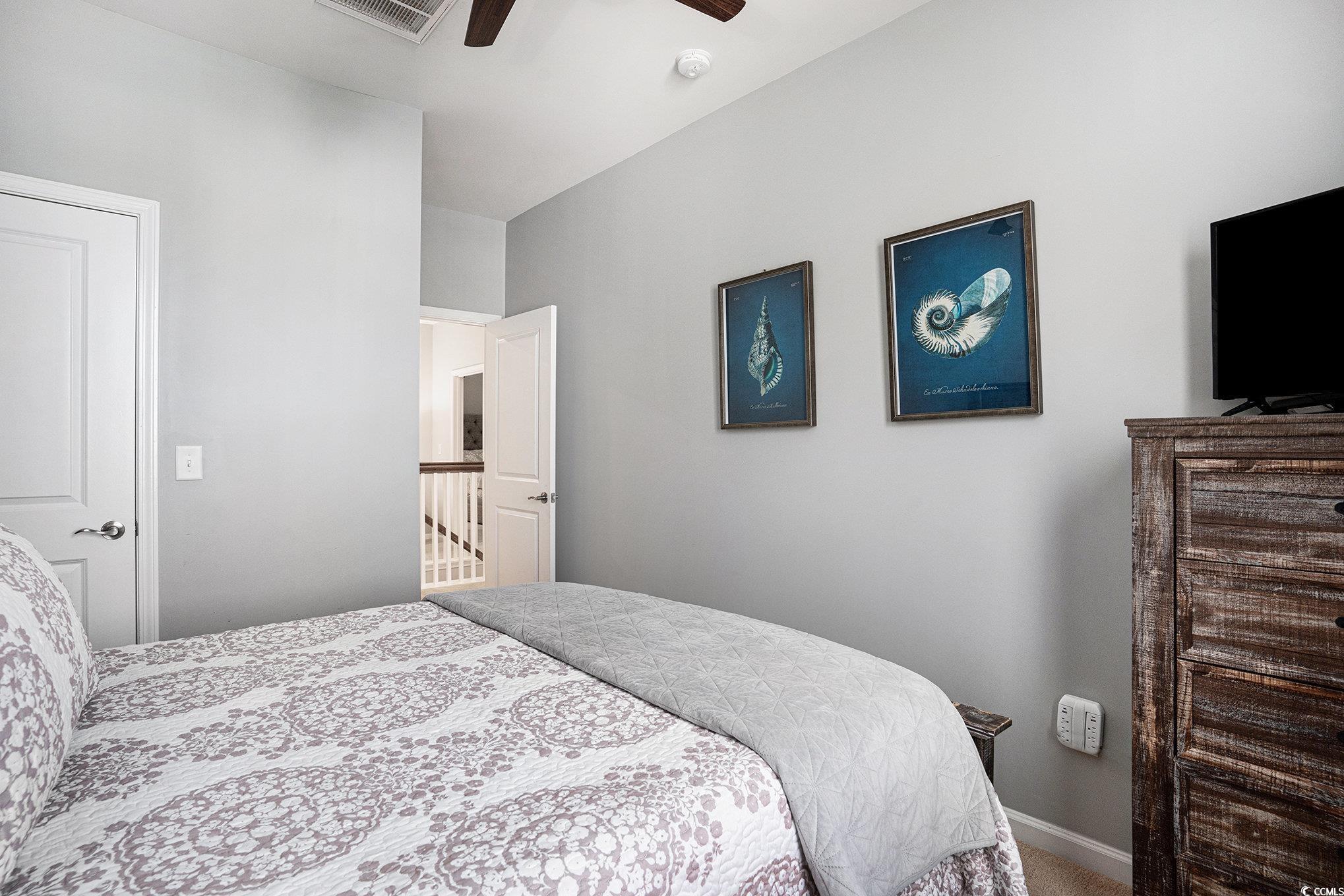 4754 Cloisters Lane Myrtle Beach, SC 29577 - Photo 17 of 32 Carpeted bedroom with a ceiling fan and baseboards