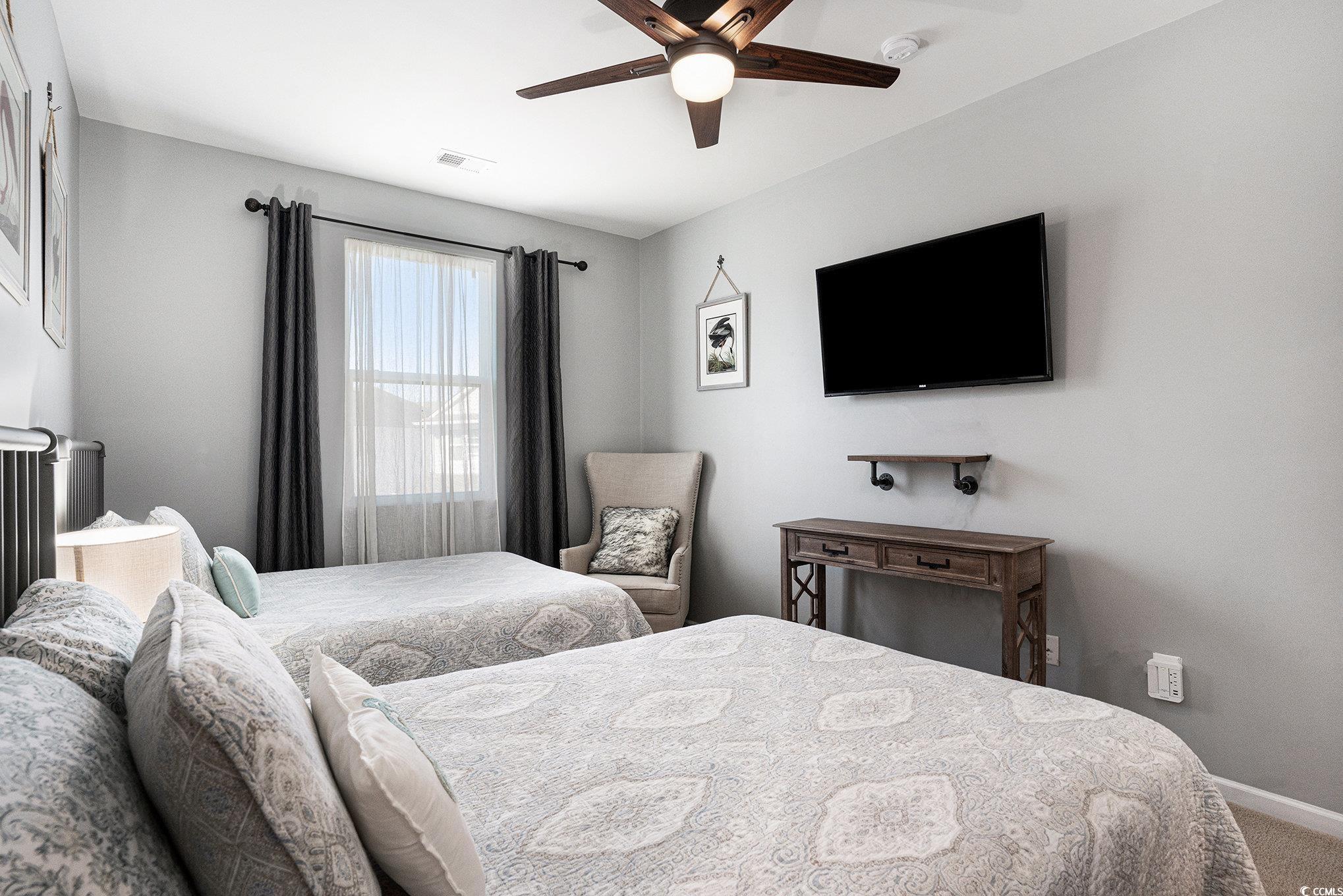 4754 Cloisters Lane Myrtle Beach, SC 29577 - Photo 20 of 32 Bedroom with a ceiling fan and carpet flooring