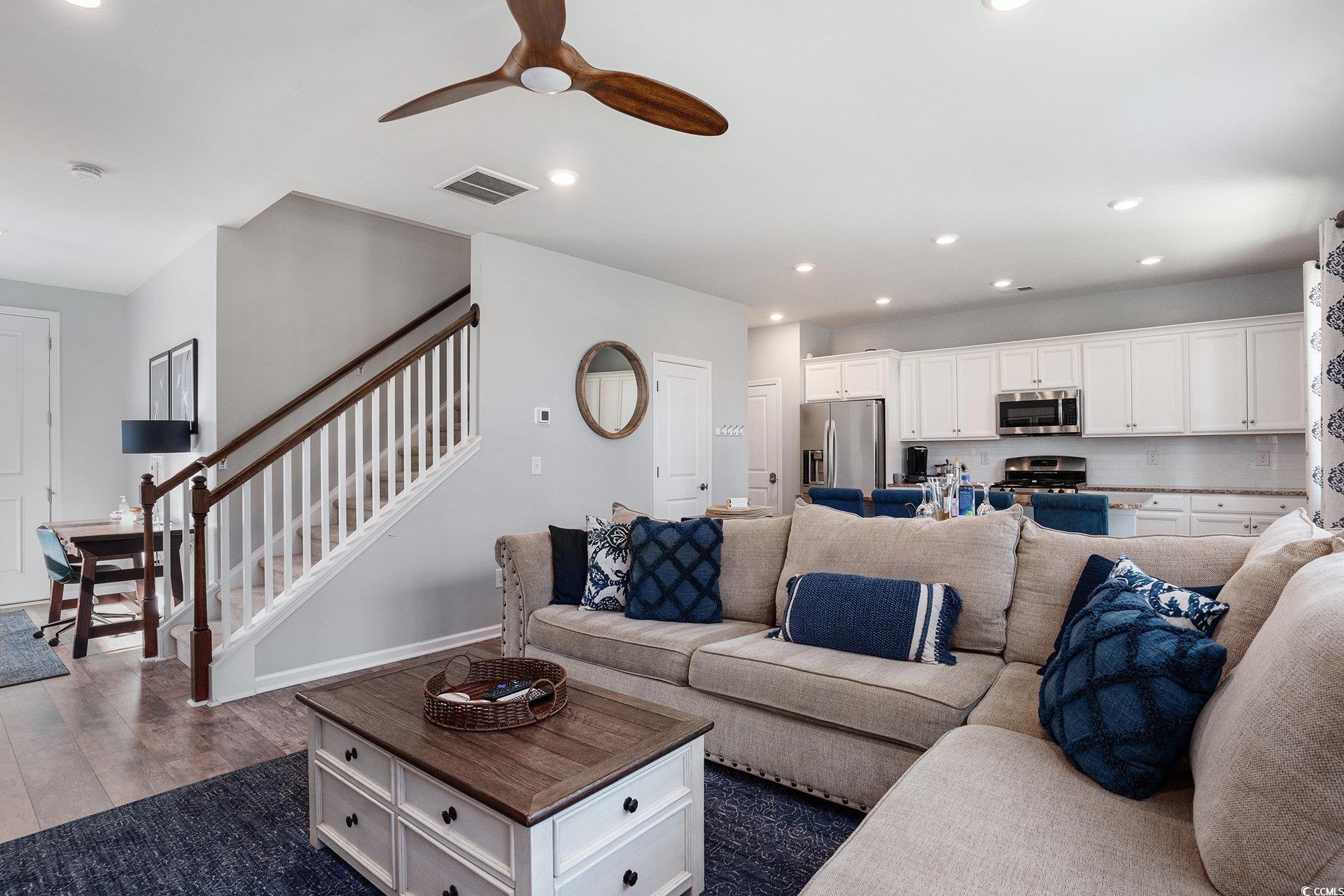 4754 Cloisters Lane Myrtle Beach, SC 29577 - Photo 7 of 32 Living area with recessed lighting, dark wood-style flooring, ceiling fan, and stairs