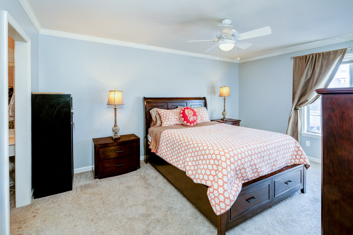 234 Pepper Ridge Circle Antioch, TN 37013 - Photo 13 of 28 a bedroom with a bed and a chandelier