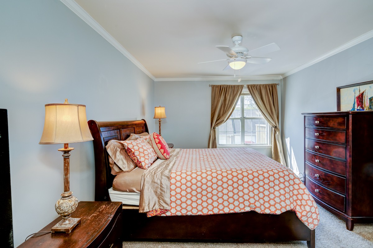 234 Pepper Ridge Circle Antioch, TN 37013 - Photo 14 of 28 a bedroom with a bed and a chandelier