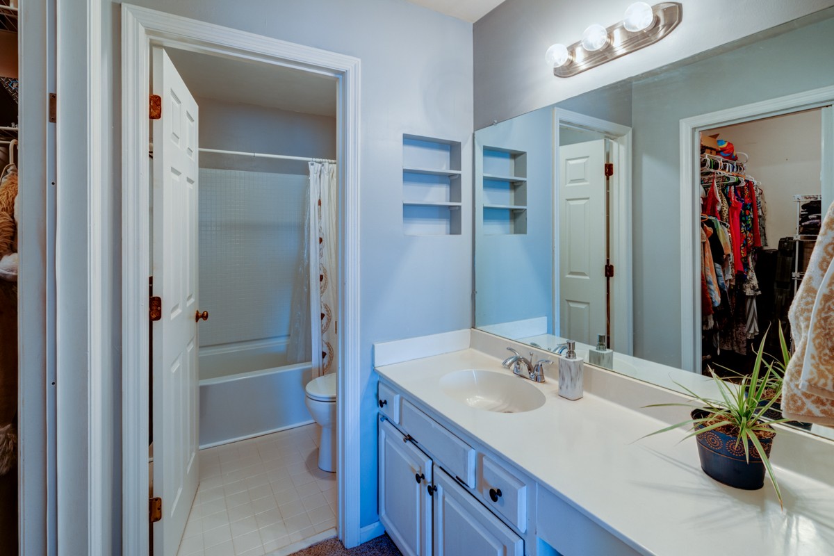 234 Pepper Ridge Circle Antioch, TN 37013 - Photo 16 of 28 a bathroom with a sink a vanity and a mirror