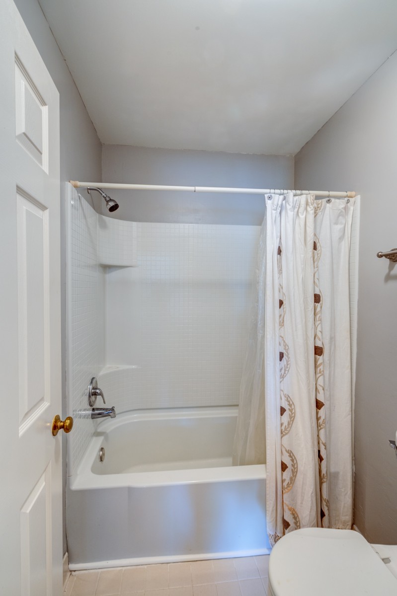 234 Pepper Ridge Circle Antioch, TN 37013 - Photo 17 of 28 a bathroom with a shower and a toilet