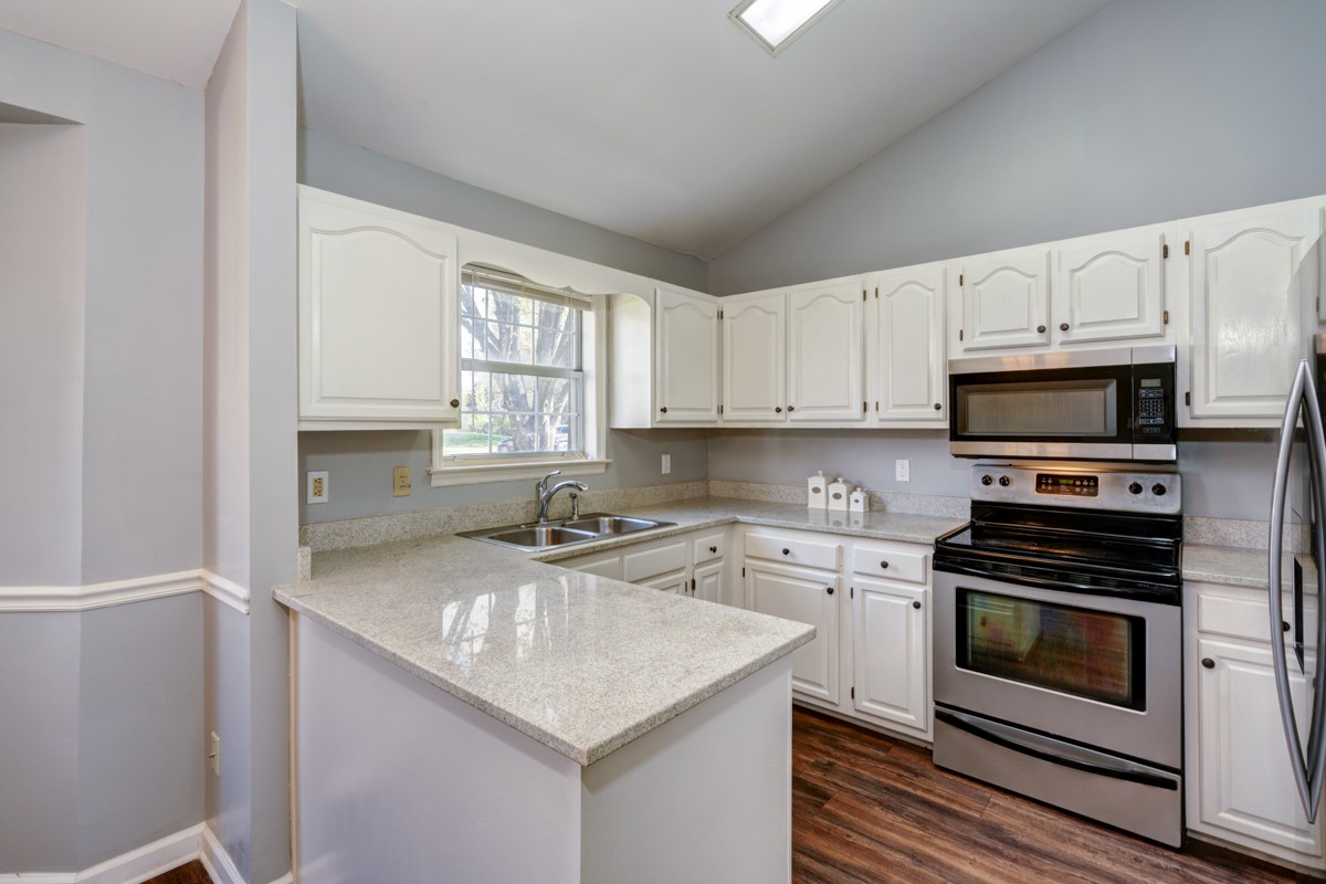 234 Pepper Ridge Circle Antioch, TN 37013 - Photo 4 of 28 a kitchen with cabinets appliances a sink and a window