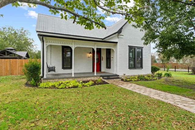 front view of a house with a yard