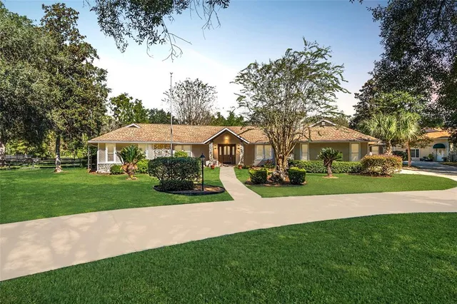 an aerial view of a residential houses with outdoor space