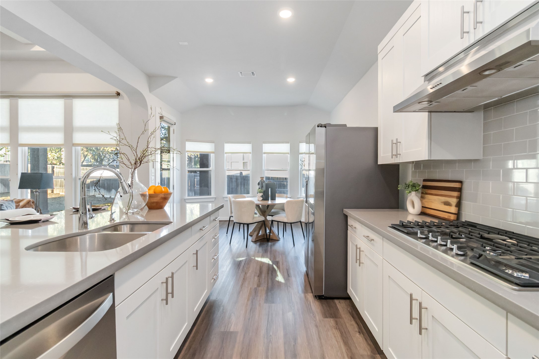 158 Sumter Way Kyle, TX 78640 - Photo 38 of 38 a kitchen with kitchen island granite countertop a sink stove and refrigerator