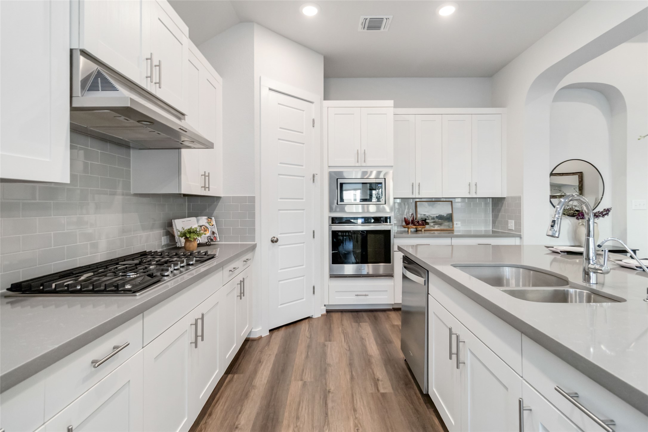 158 Sumter Way Kyle, TX 78640 - Photo 16 of 38 a kitchen with granite countertop a sink stainless steel appliances and cabinets