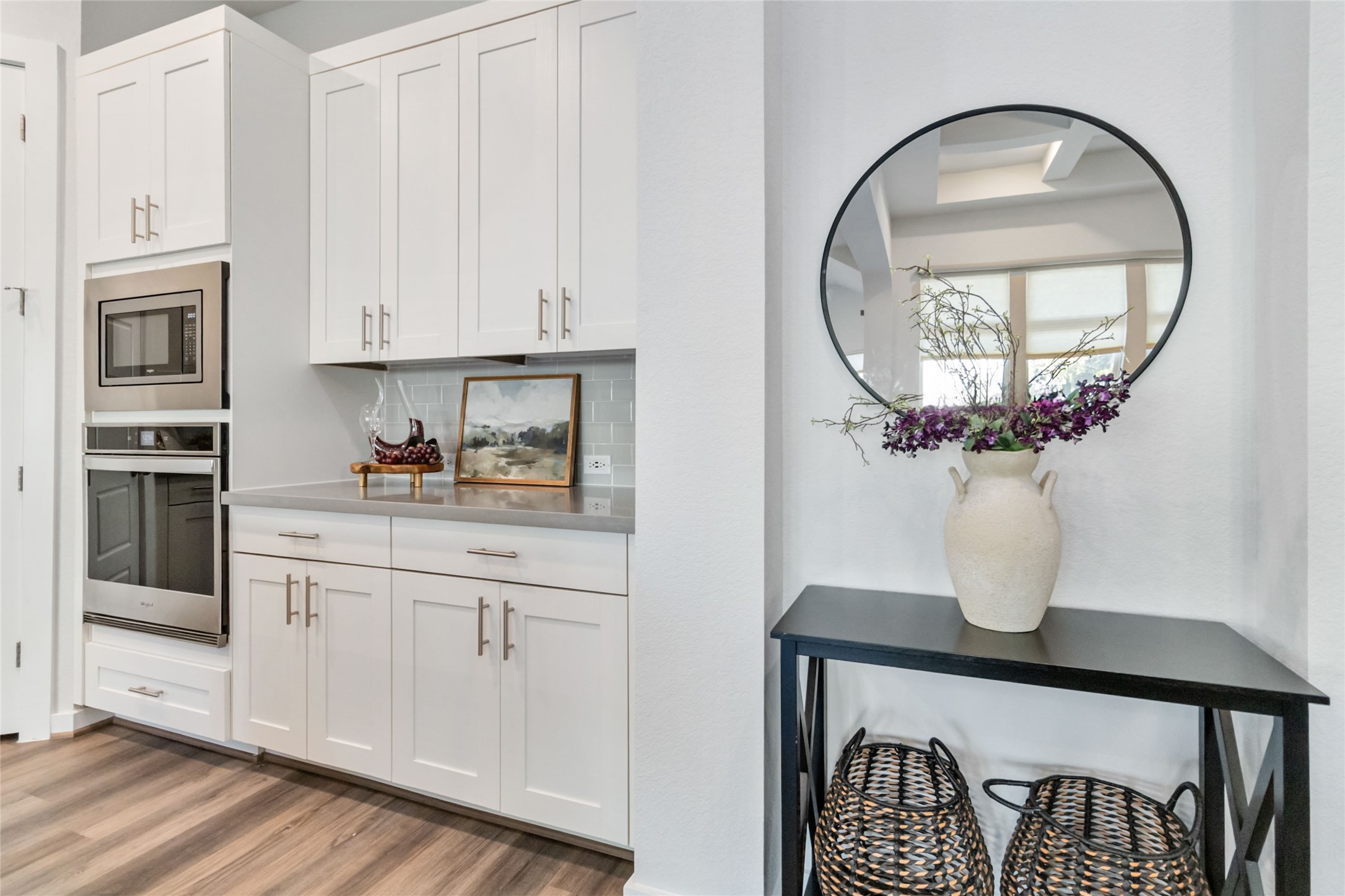158 Sumter Way Kyle, TX 78640 - Photo 17 of 38 a kitchen with stainless steel appliances granite countertop a stove a sink and a granite counter tops with wooden floors