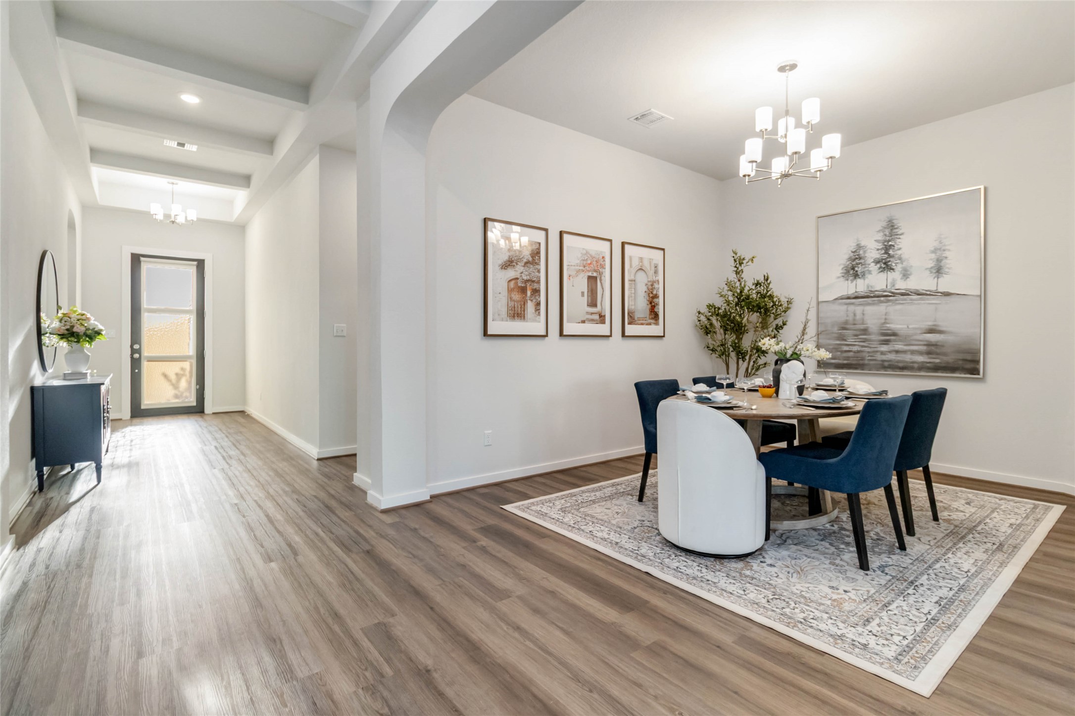 158 Sumter Way Kyle, TX 78640 - Photo 18 of 38 a dining room with furniture a chandelier and wooden floor