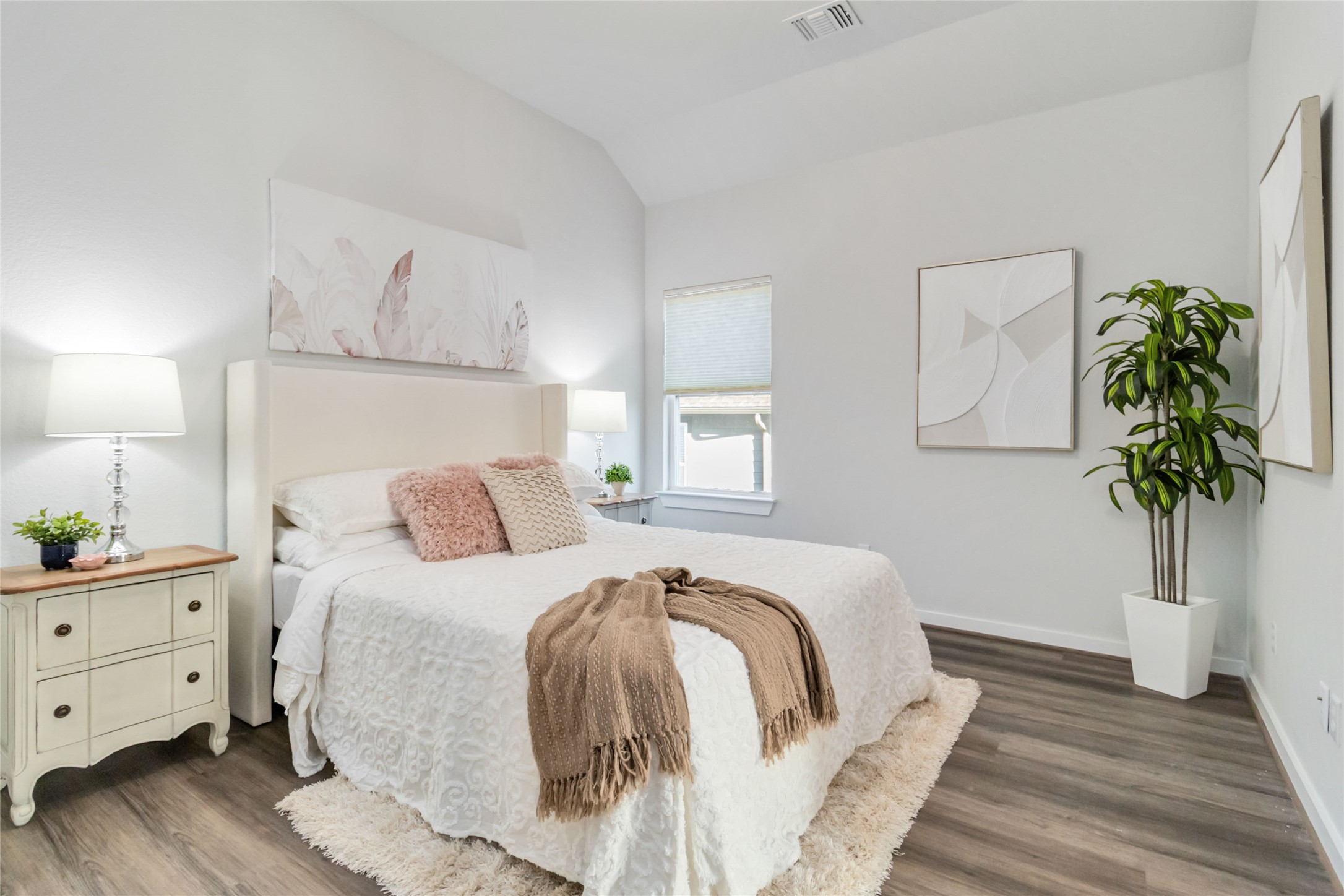 158 Sumter Way Kyle, TX 78640 - Photo 23 of 38 a bedroom with a bed and a potted plant