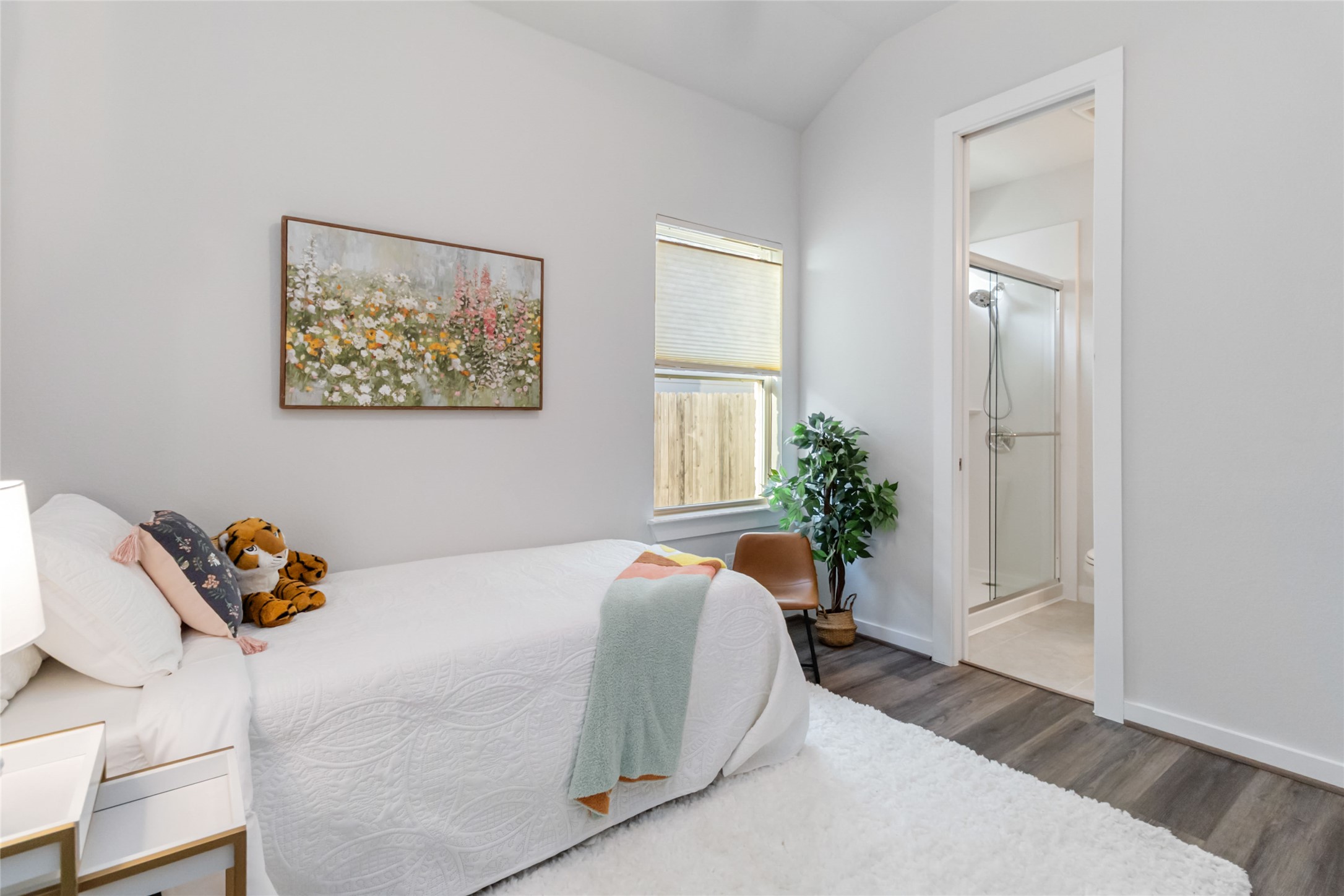 158 Sumter Way Kyle, TX 78640 - Photo 24 of 38 a bed sitting in a bedroom next to a window