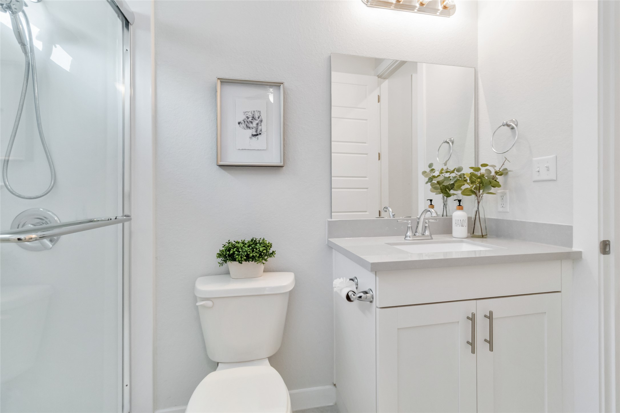 158 Sumter Way Kyle, TX 78640 - Photo 25 of 38 a bathroom with a sink a toilet and a mirror