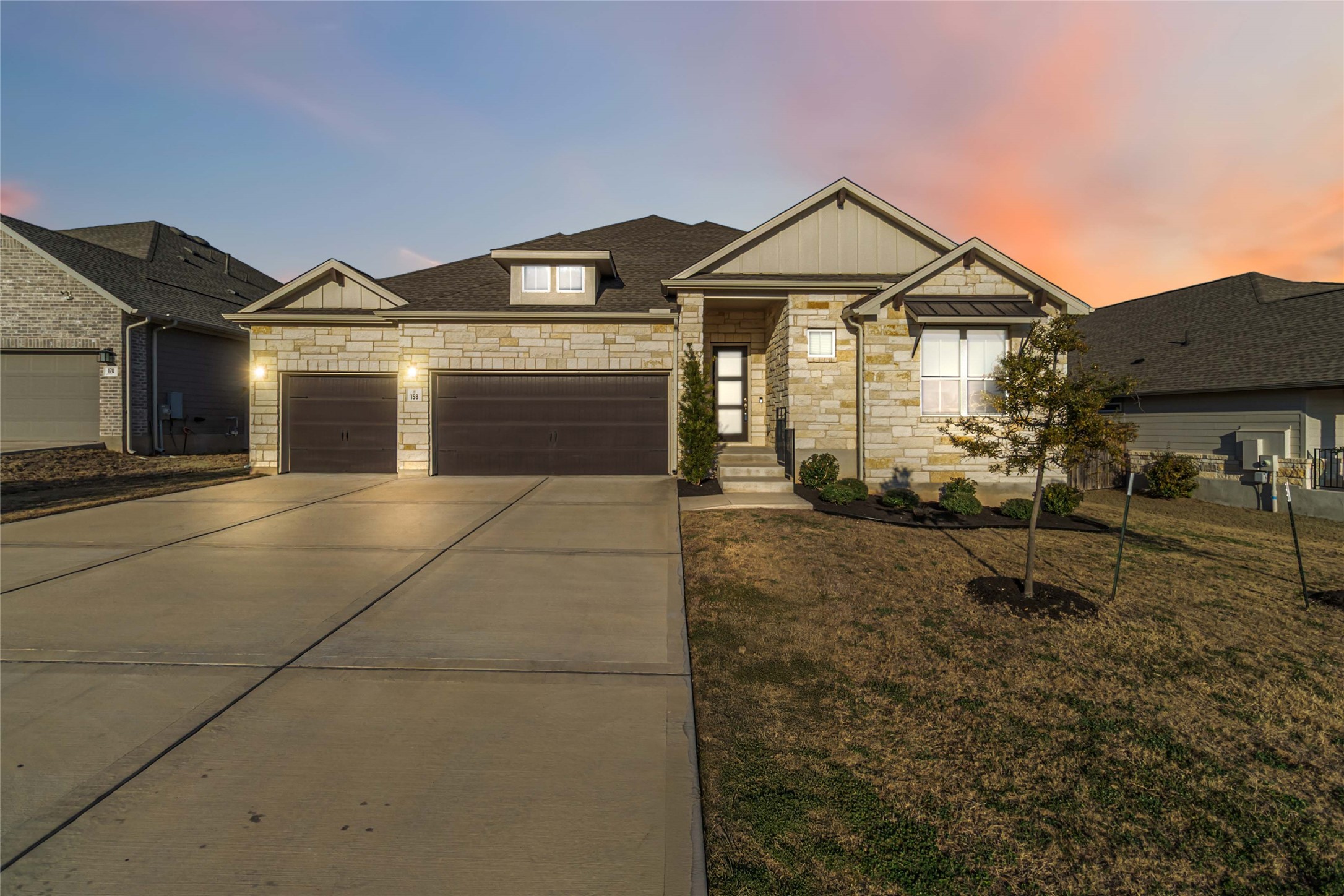 158 Sumter Way Kyle, TX 78640 - Photo 3 of 38 a view of a town with brick walls and windows