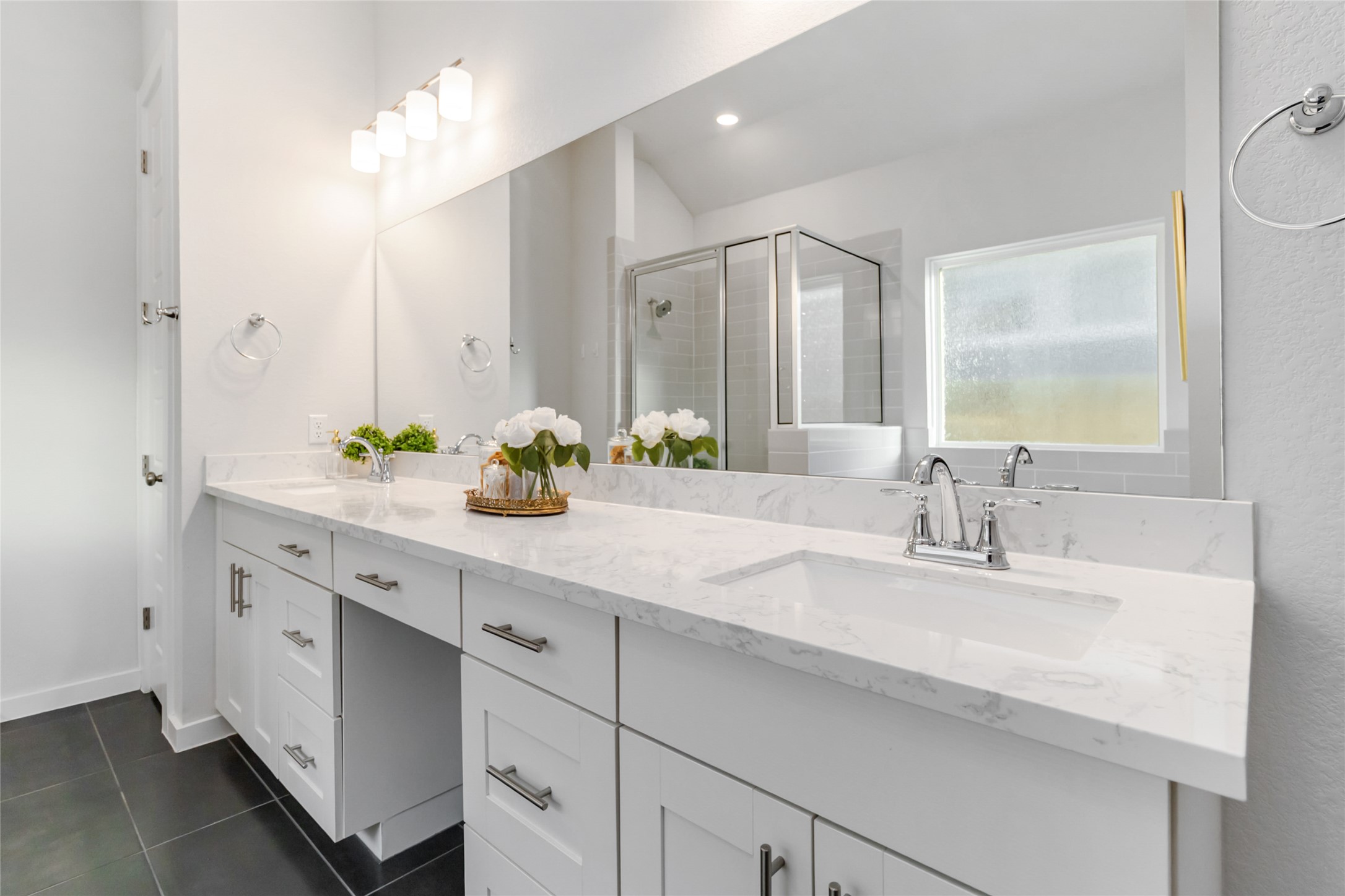 158 Sumter Way Kyle, TX 78640 - Photo 30 of 38 a bathroom with double vanity sinks and a mirror