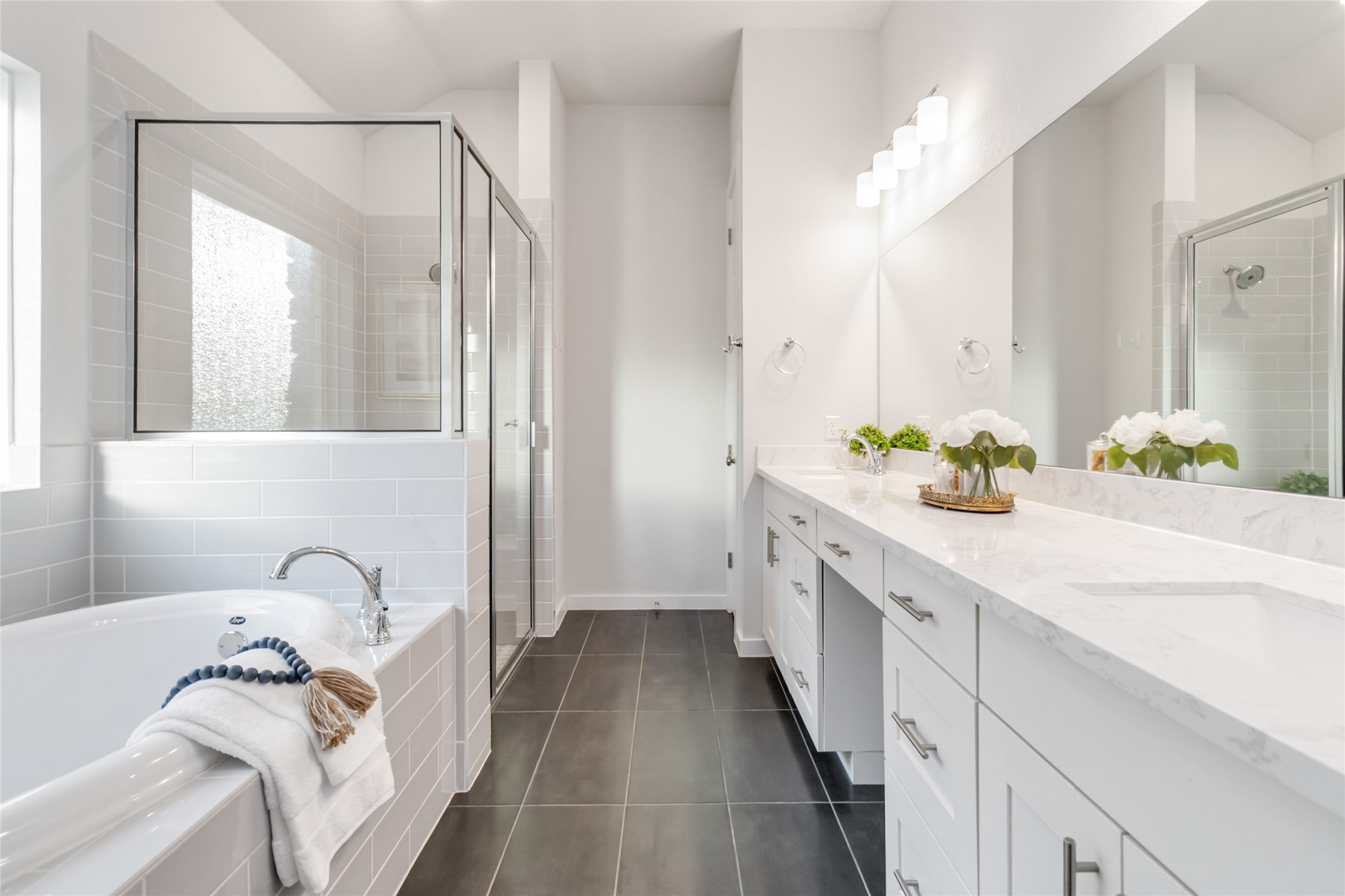 158 Sumter Way Kyle, TX 78640 - Photo 32 of 38 a spacious bathroom with a granite countertop sink and a bathtub
