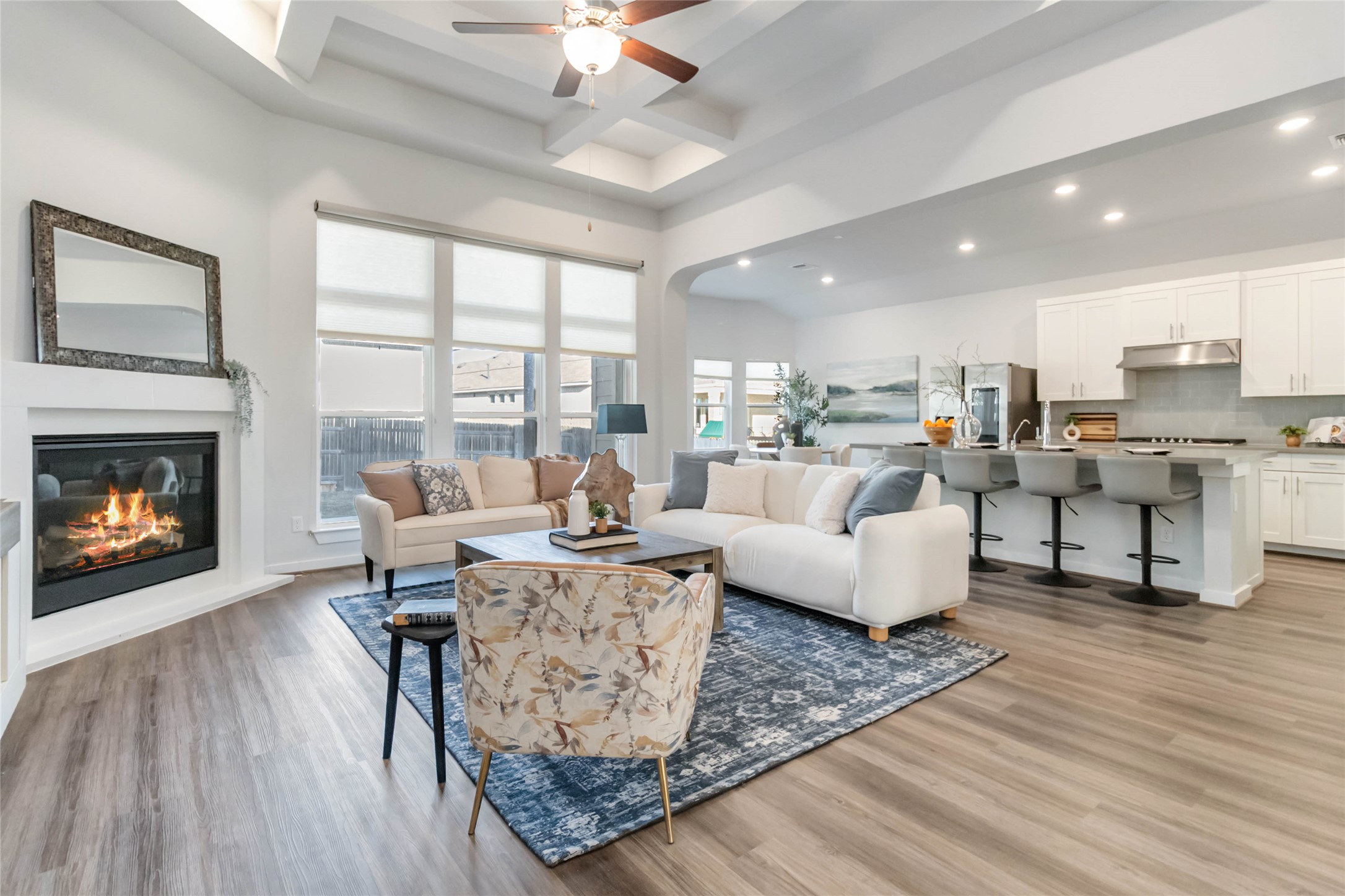 158 Sumter Way Kyle, TX 78640 - Photo 7 of 38 a living room with furniture wooden floor and a fireplace
