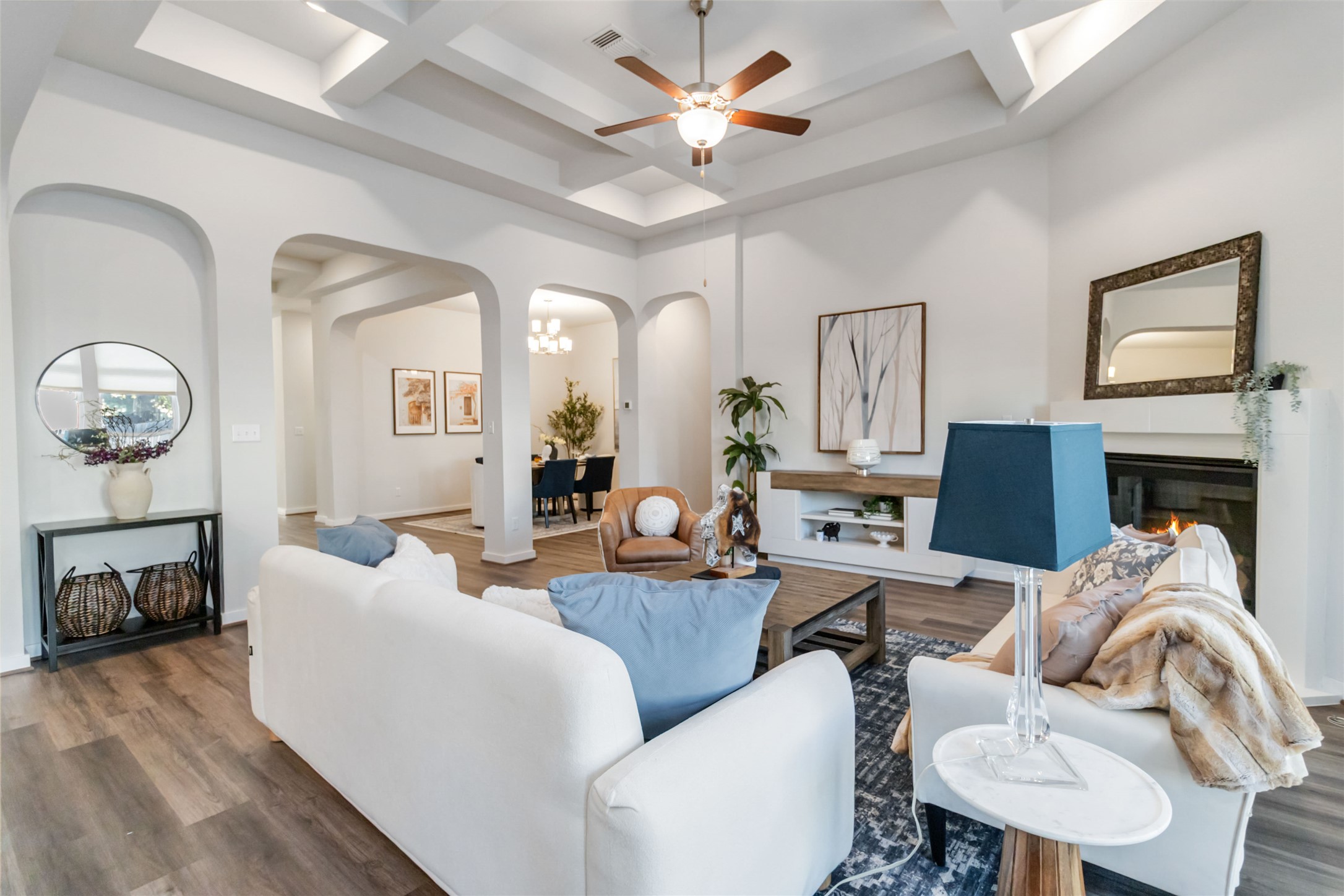 158 Sumter Way Kyle, TX 78640 - Photo 10 of 38 a living room with furniture a fireplace and a chandelier