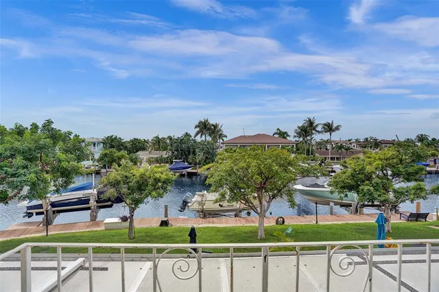 a view of a chairs and table on the lake