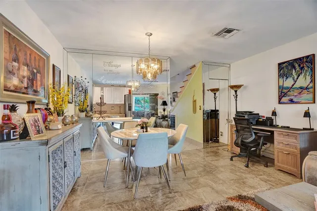 a view of a yard with table and chairs and a big yard