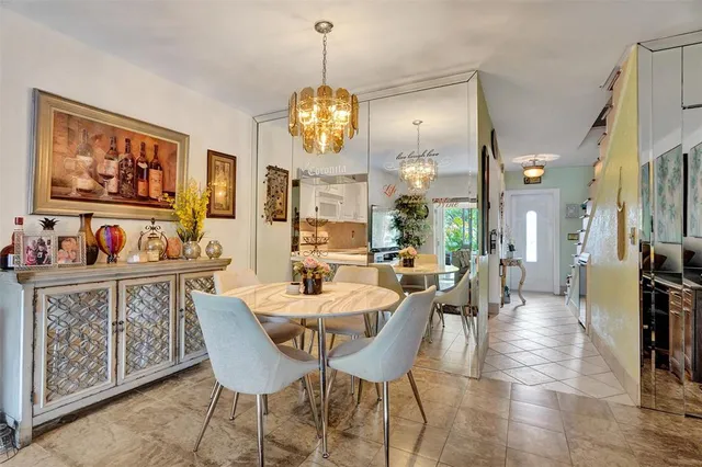 a view of a house with a yard patio and sitting area