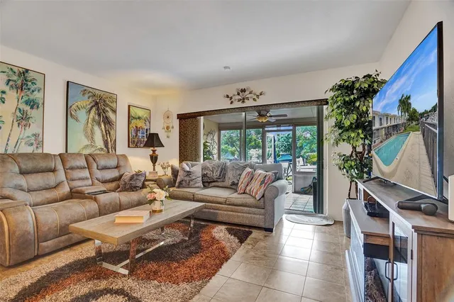 a view of a backyard with sitting area