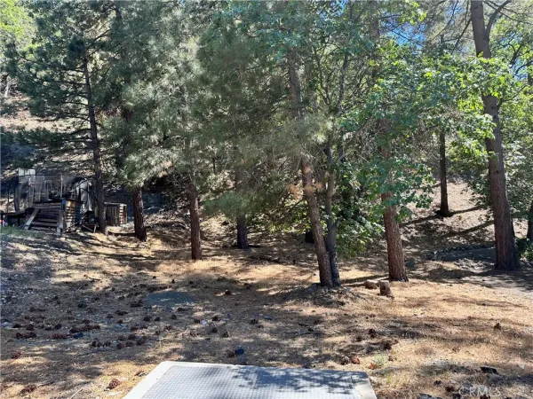a backyard of a house with a yard and outdoor seating