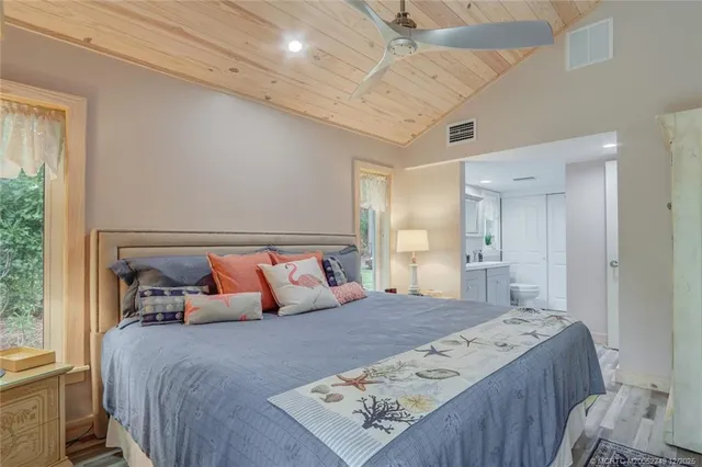 a living room with furniture ceiling fan and a window