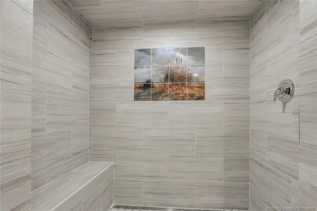 a view of a yard with plants and trees