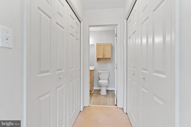 a view of a bathroom from a hallway