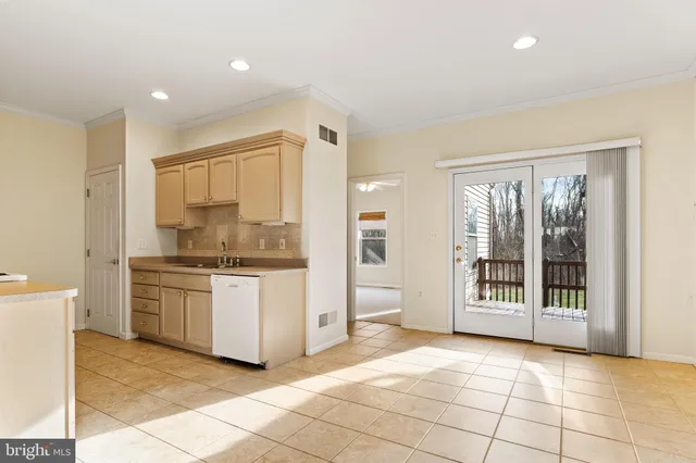 a open kitchen with a sink and a stove top oven