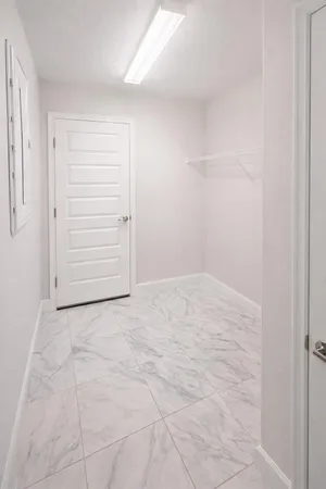 an empty room with shelves