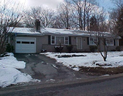 176 Walnut Tree Hill Road Shelton, CT 06484 - Photo 1 of 1 a front view of a house with a yard covered with snow
