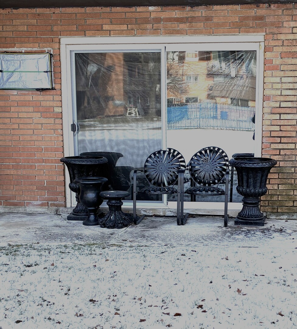 2340 186th Street, Unit 7 Lansing, IL 60438 - Photo 13 of 14 a bench sitting in front of a building