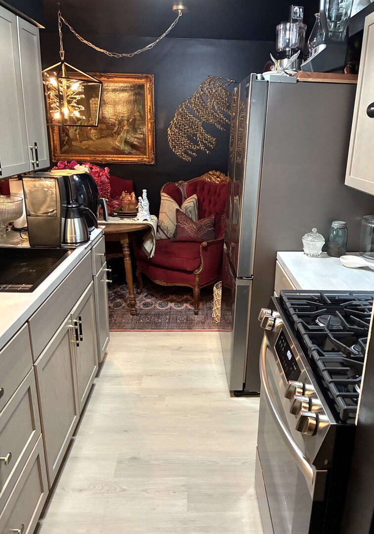 2340 186th Street, Unit 7 Lansing, IL 60438 - Photo 2 of 14 a kitchen with granite countertop a stove and a sink