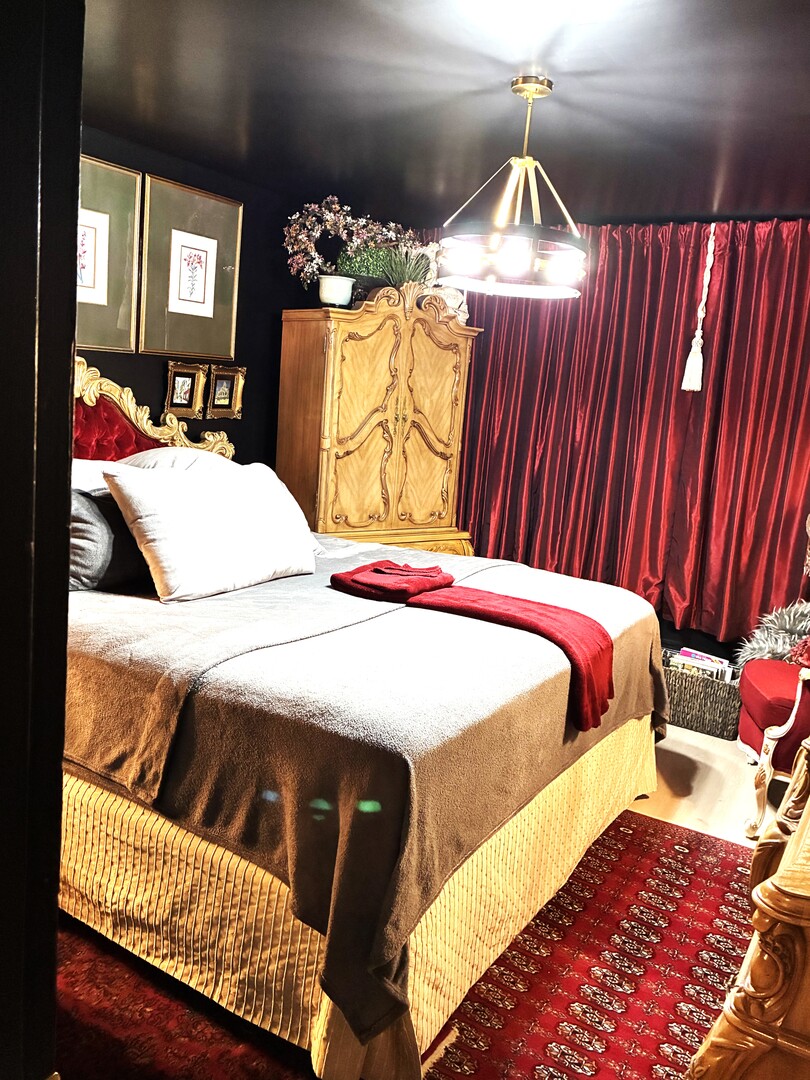 2340 186th Street, Unit 7 Lansing, IL 60438 - Photo 7 of 14 a bedroom with a bed closet and mirror