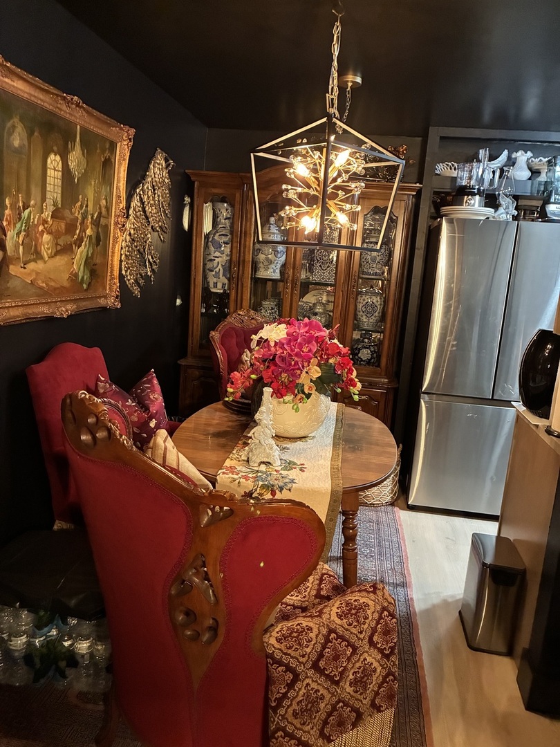 2340 186th Street, Unit 7 Lansing, IL 60438 - Photo 8 of 14 a view of a dining room with furniture a chandelier and window