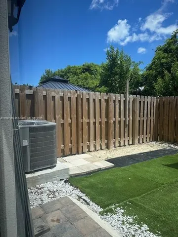 a kitchen with a sink a counter top space cabinets and stainless steel appliances
