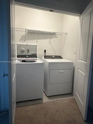 a kitchen with stainless steel appliances a sink a stove top oven a counter top space and cabinets