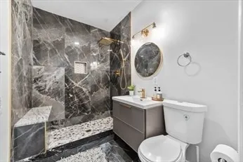 a bathroom with a toilet a sink and a shower