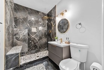 15 Ancona Road, Unit 1 Worcester, MA 01604 - Photo 9 of 11 a bathroom with a toilet a sink and a shower