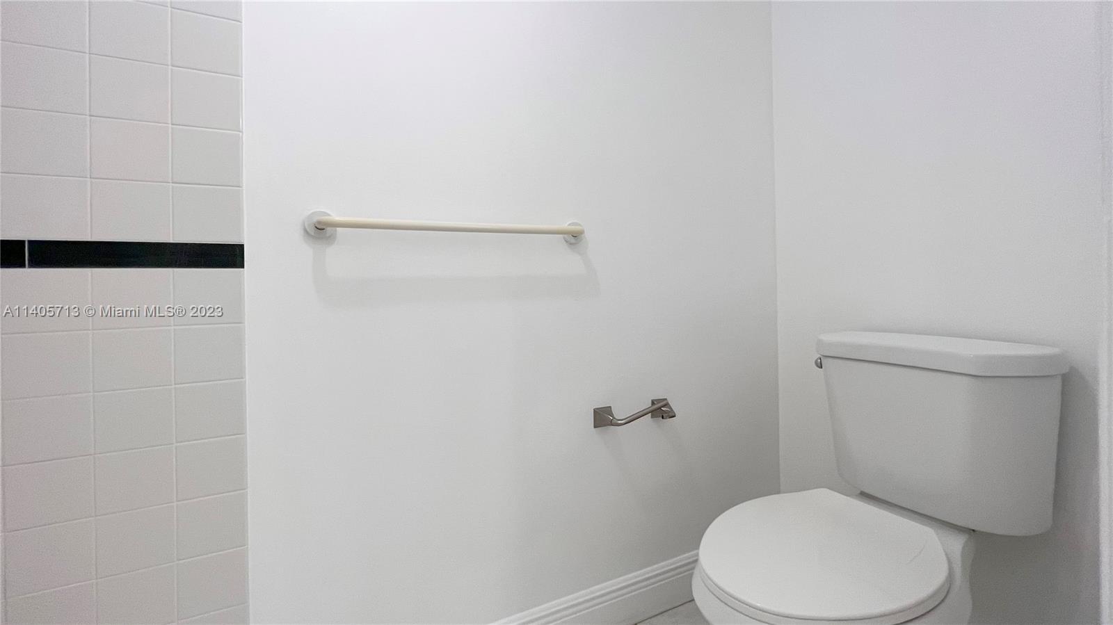 The Hammocks Miami, FL 33196 - Photo 17 of 20 a white toilet sitting next to a shower