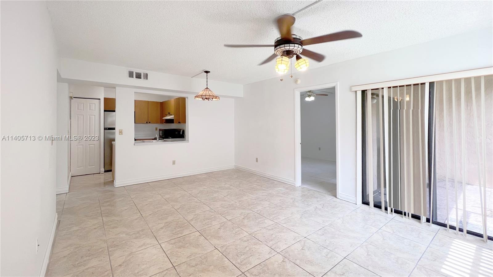 The Hammocks Miami, FL 33196 - Photo 4 of 20 a view of a kitchen with a sink and a refrigerator